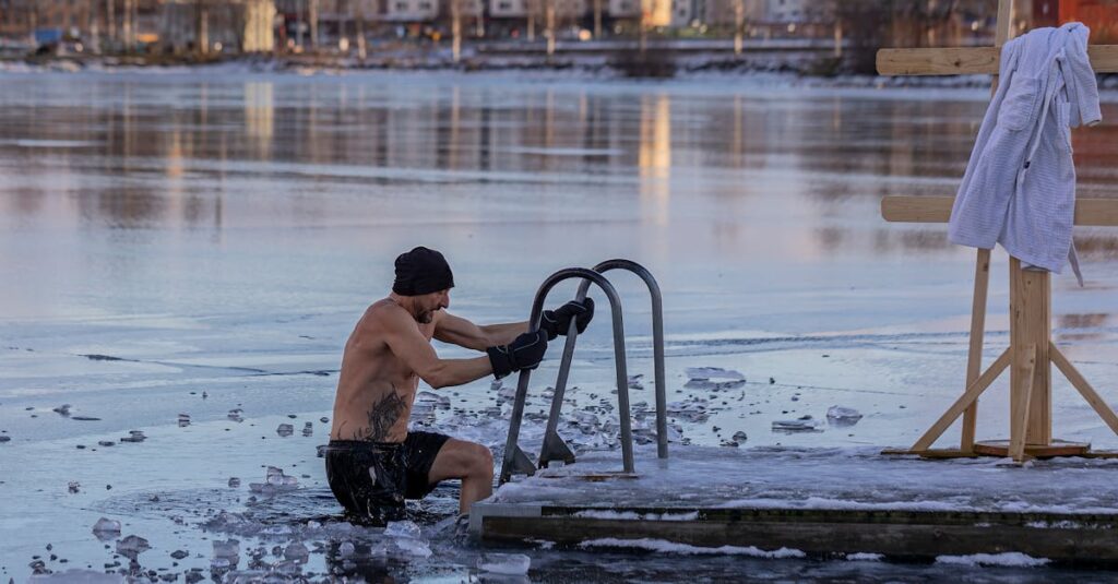 Shirtless man in freezing lake near Ludvika, Sweden, captured during a winter swim. Sublime ice scenery.