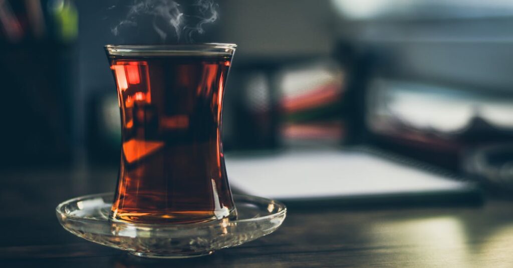 Close-up of steaming Turkish tea in a traditional glass, creating a cozy and inviting atmosphere.