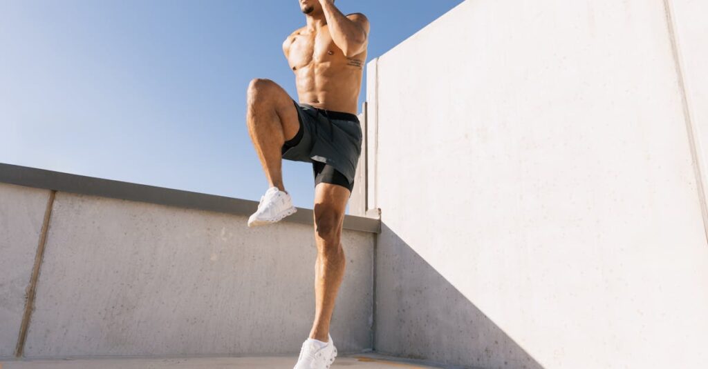 Male athlete doing cardio workout on a rooftop under blue sky in Austin, Texas.