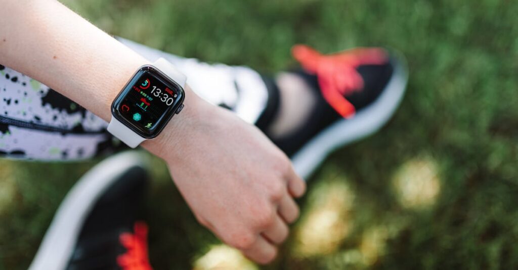 Close-up of a smartwatch on a woman's wrist during outdoor fitness activity.