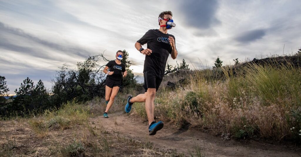 Athletes in VO2 masks running on a trail, showcasing outdoor athletic performance.